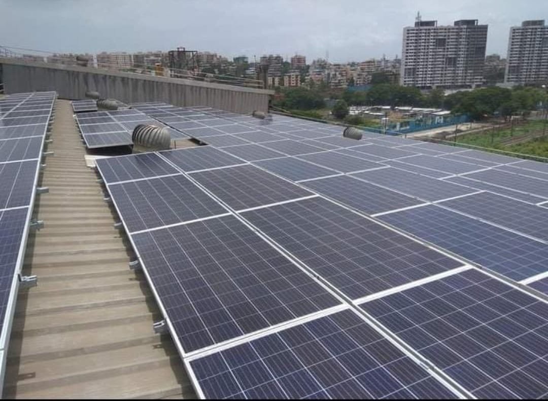 Commercial Building Rooftop Solar with City Skyline